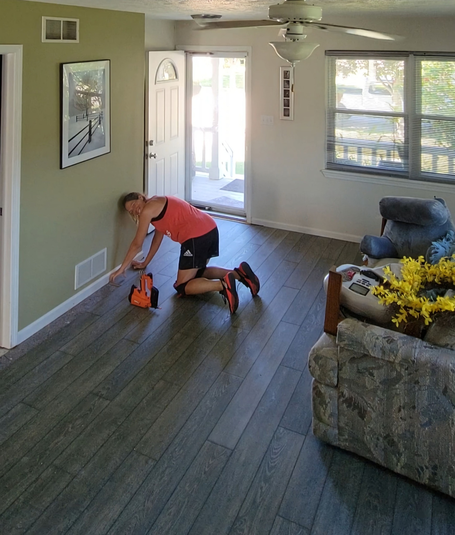 Amy working on installing new floors.